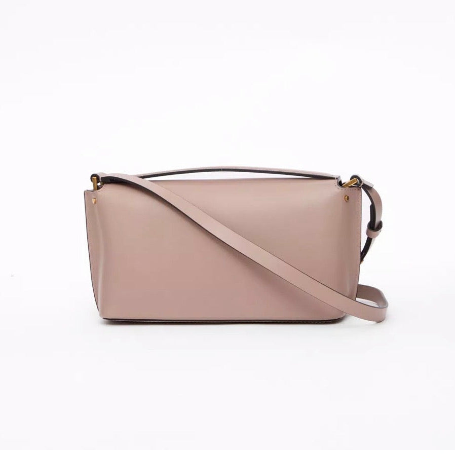 Beige handbag with a strap on a white background