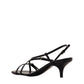 Black high-heeled sandal on a white background