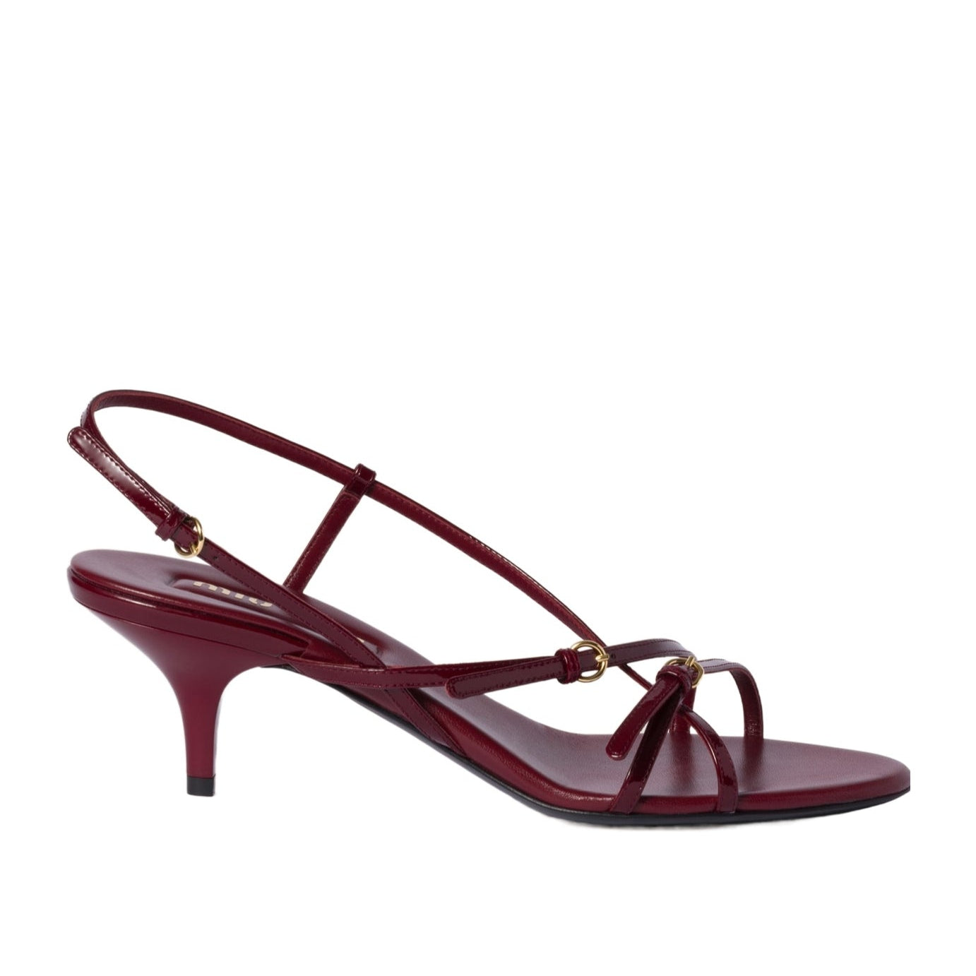 Maroon sandal with thin straps on a white background