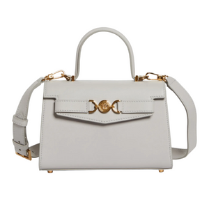 Gray handbag with gold accents on a white background