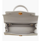 Gray handbag with gold accents 