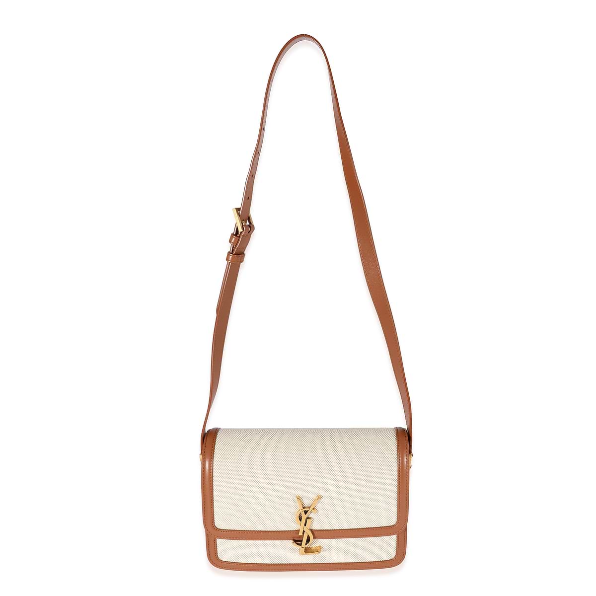 White handbag with brown leather accents on a white background
