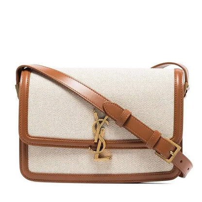 Designer handbag with brown strap and visible logo on a white background