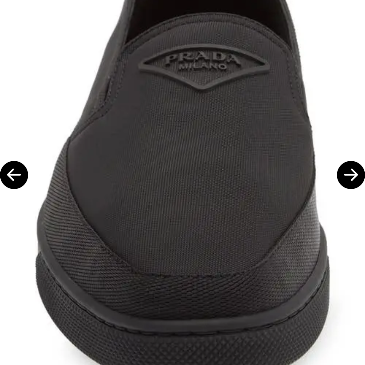 Black slip-on shoe with brand logo on a white background
