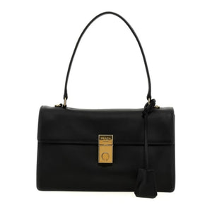 A black leather handbag with a structured rectangular shape, a single top handle, a front flap, and a gold-tone lock closure. A black leather tag hangs from the side, and the bag is photographed against a plain white background.
