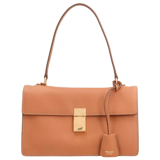 A Prada tan leather handbag with a gold-tone turn-lock clasp and a hanging leather tag, shown against a plain white background.