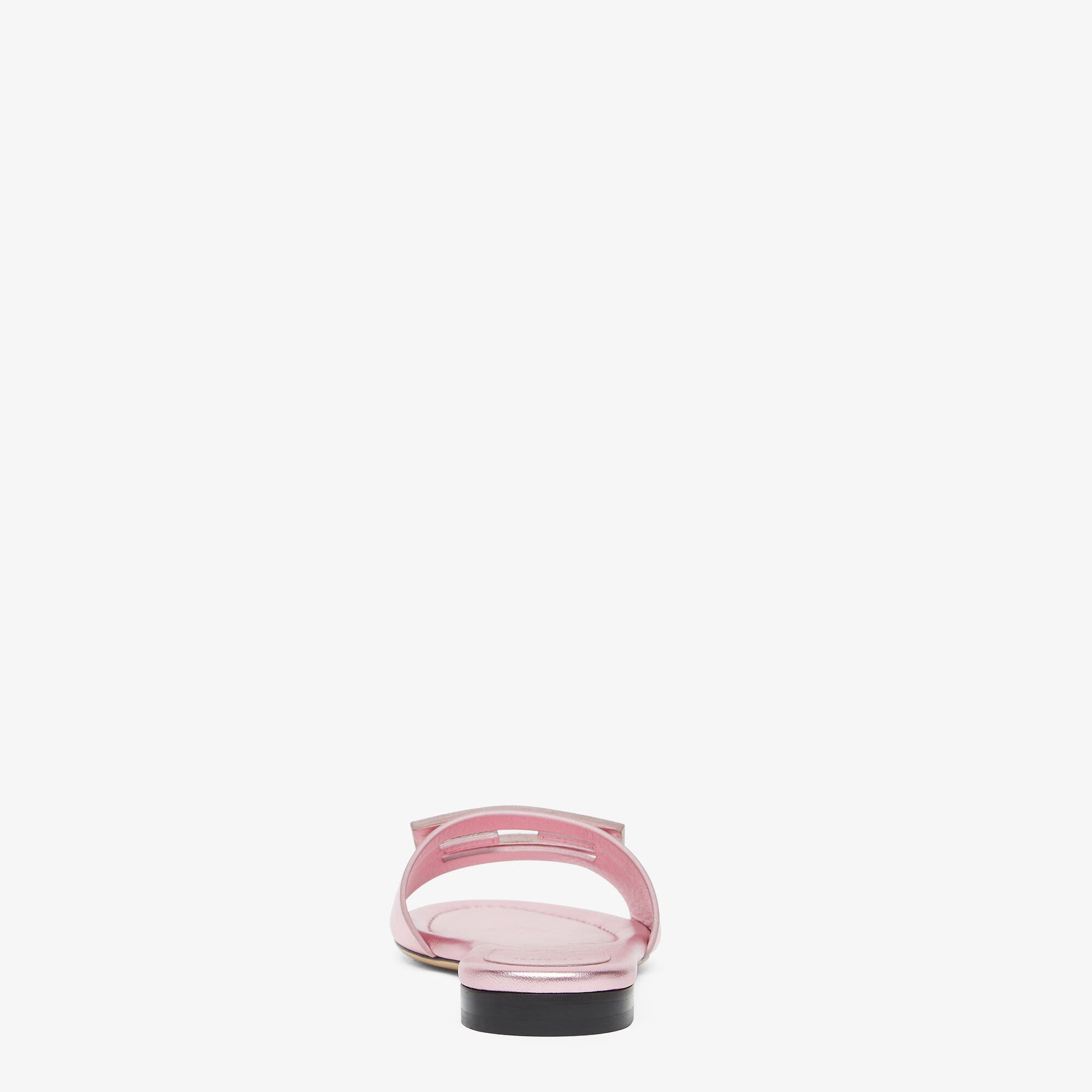 Pink sandal with a black sole on a white background