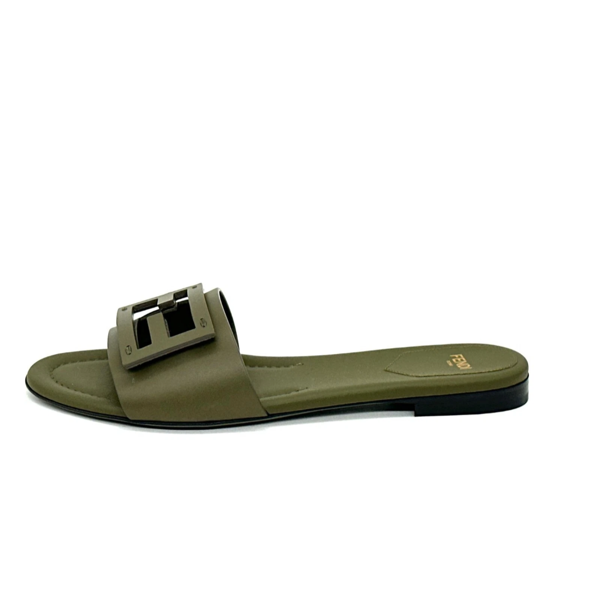 Green sandal with a buckle on a white background