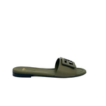 Green Fendi sandal with a logo on a white background