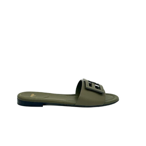 Green Fendi sandal with a logo on a white background