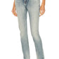 Light blue jeans worn by a person on a white background