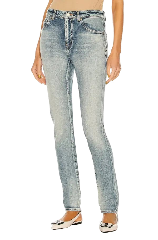 Light blue jeans worn by a person on a white background