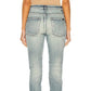 Light blue jeans worn by a person on a white background