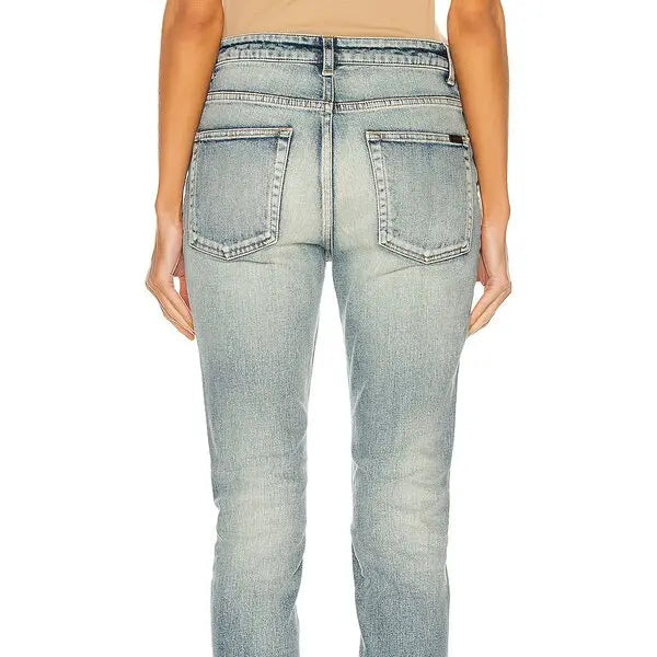 Light blue jeans worn by a person on a white background
