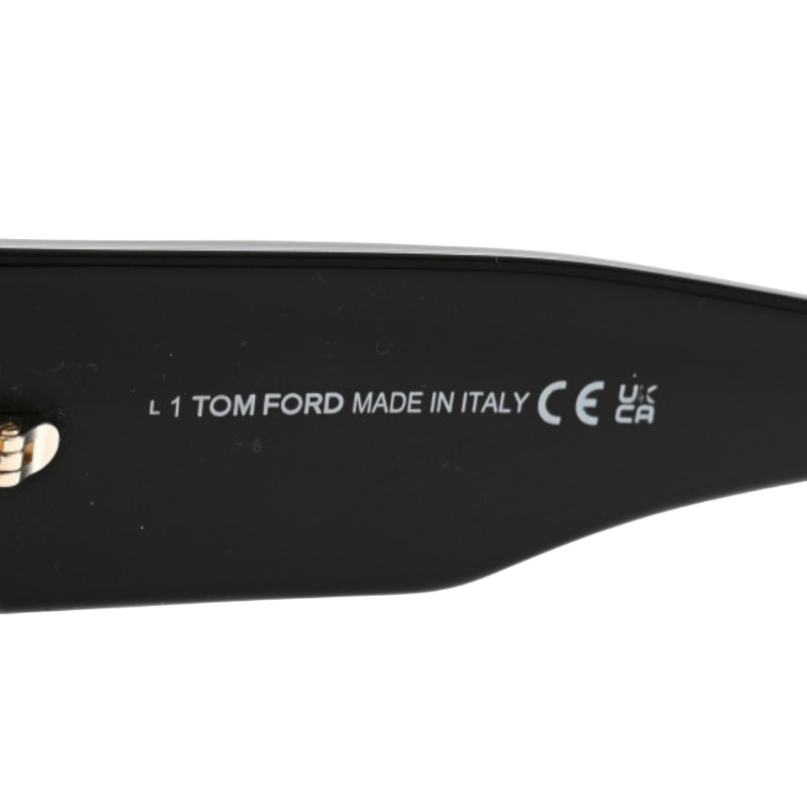 Close-up of a black product with 'Tom Ford' branding on a white background