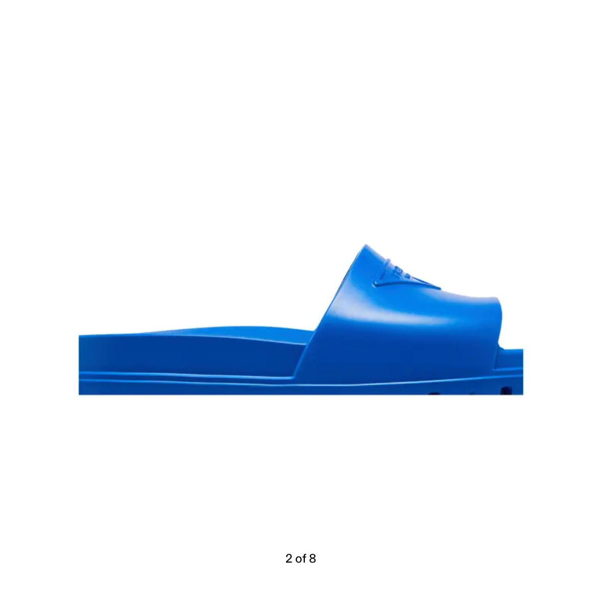 Blue Prada rubber slide on a website with price and option to buy.