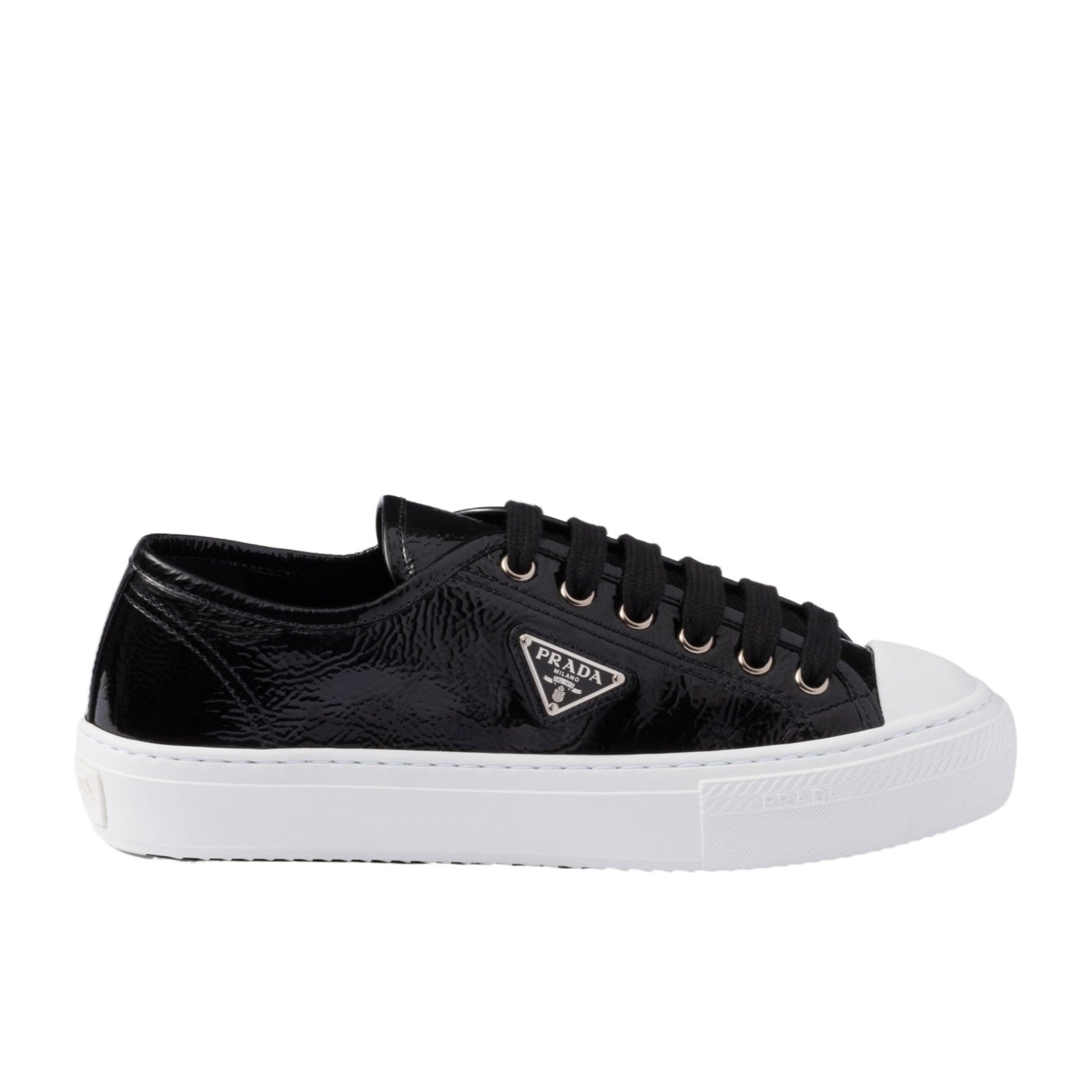 Black sneaker with white sole on a white background