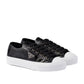 Black sneakers with white soles on a white background