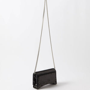 Black handbag with a chain strap on a white background