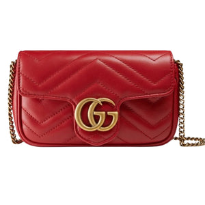 Red quilted handbag with gold chain and Gucci logo on a white background