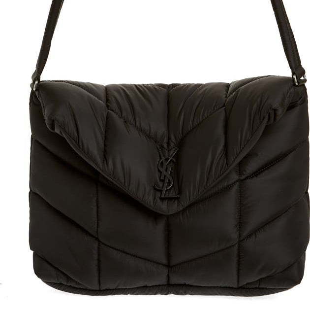 Black puffer bag with a brand logo on a white background