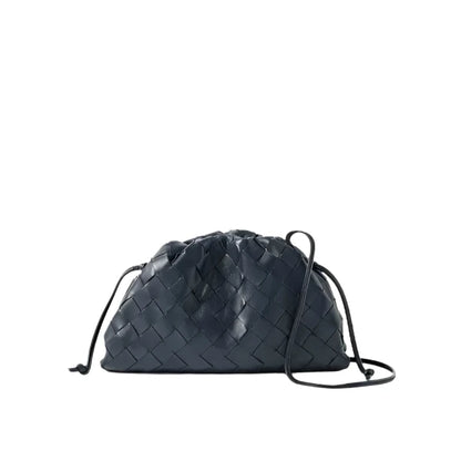 Black woven drawstring bag on a light gray background