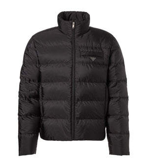 Black puffer jacket on a light gray background