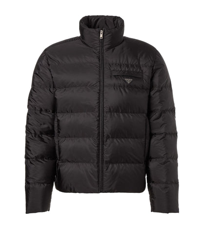 Black puffer jacket on a light gray background
