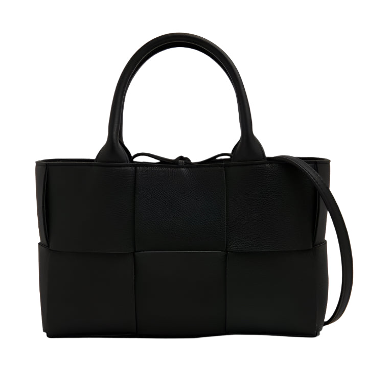 Black woven Bottega Veneta handbag on a white background