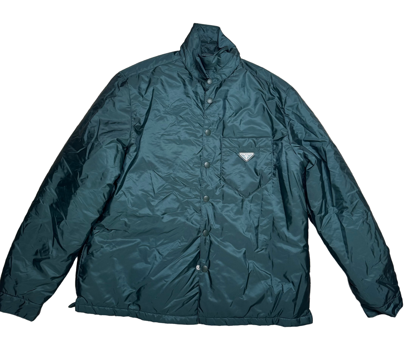 Green jacket on a beige carpet