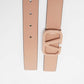 Beige belt with a rose gold buckle on a light gray background