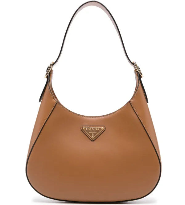 Brown Prada handbag on a white background