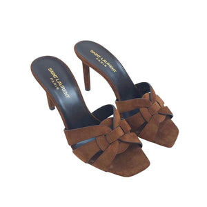 Brown suede high-heeled shoes with 'Saint Laurent' branding on a white background