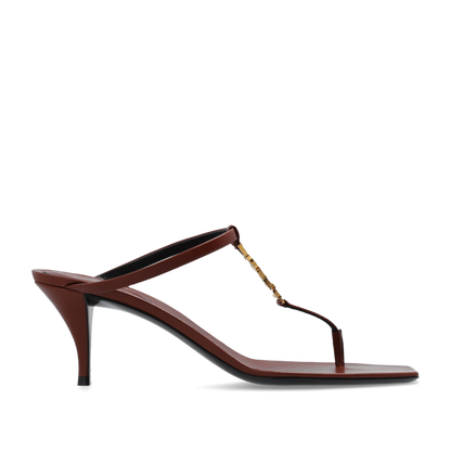 Brown high-heeled sandal with a thin strap on a white background