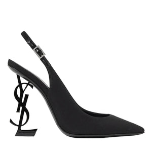 Black high-heeled shoe with a unique heel design on a white background