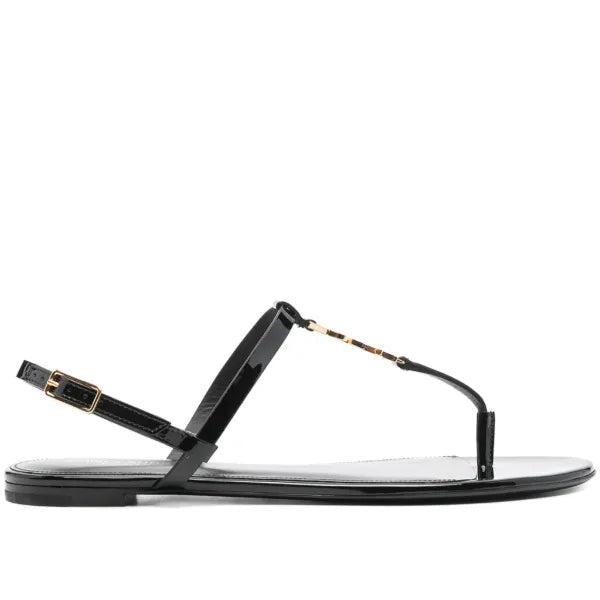 Black sandal with thin strap on a white background
