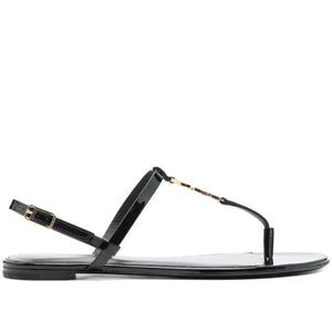 Black sandal with thin strap on a white background