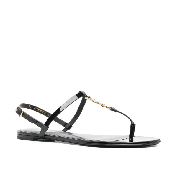 Black sandal with thin straps on a white background