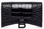 Black crocodile-patterned clutch bag on a white background