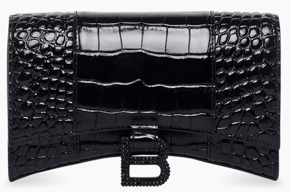 Black crocodile-patterned clutch bag on a white background