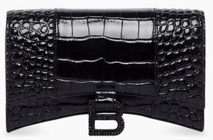 Black crocodile-patterned clutch bag on a white background