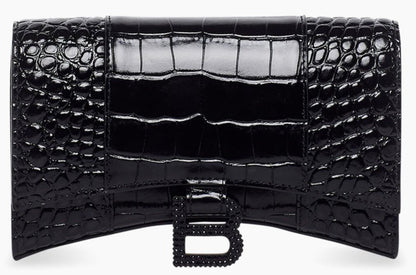 Black crocodile-patterned clutch bag on a white background