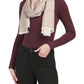 Person wearing a burgundy sweater and black pants with a beige scarf on a white background