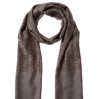 Gucci scarf on a white background with product details and purchase options.