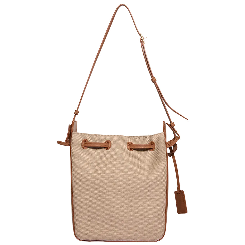 Beige bucket bag with brown leather straps on a white background