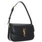 Black handbag with gold logo on a white background