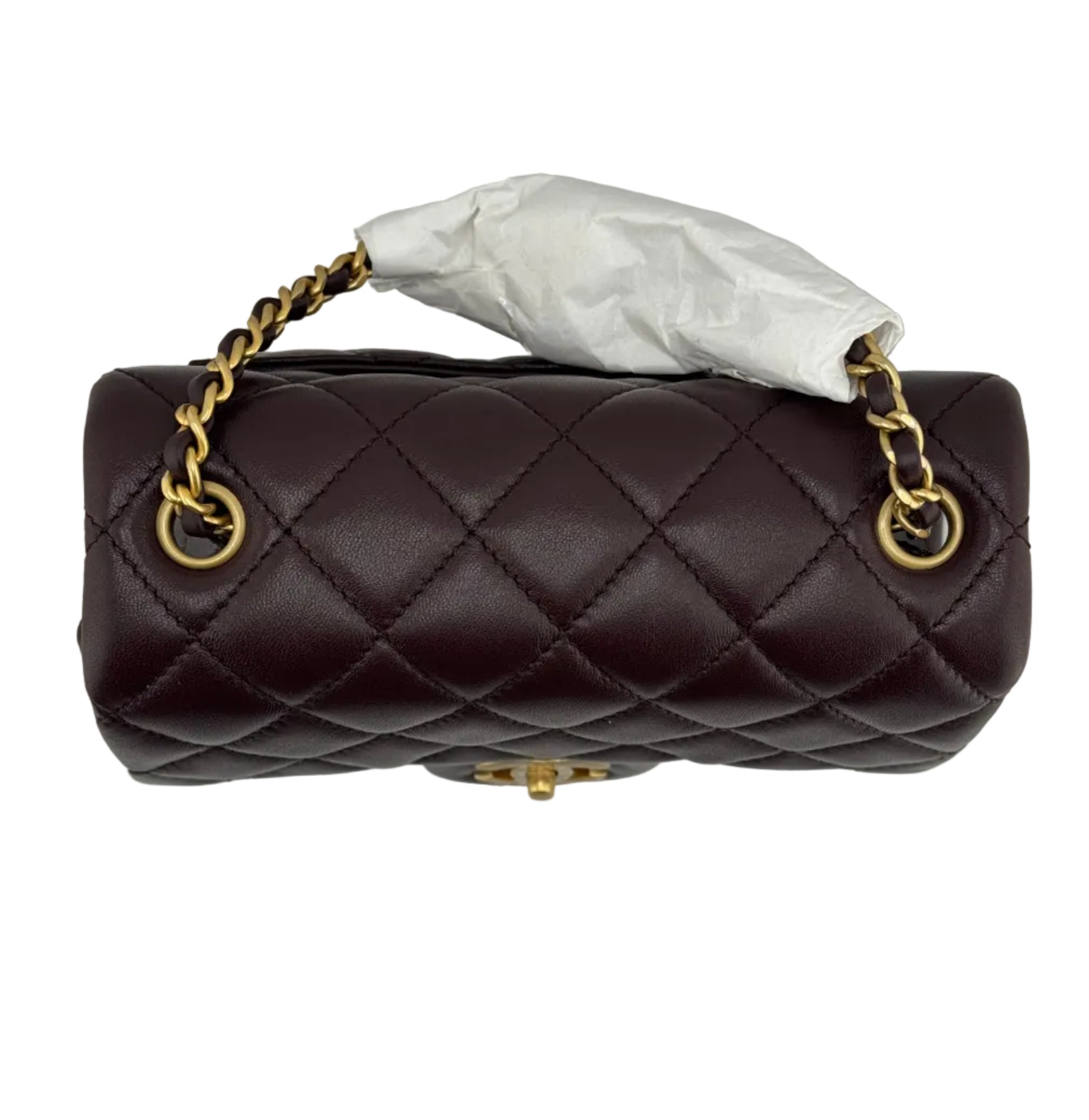 Brown quilted handbag with gold chain strap on a light gray background