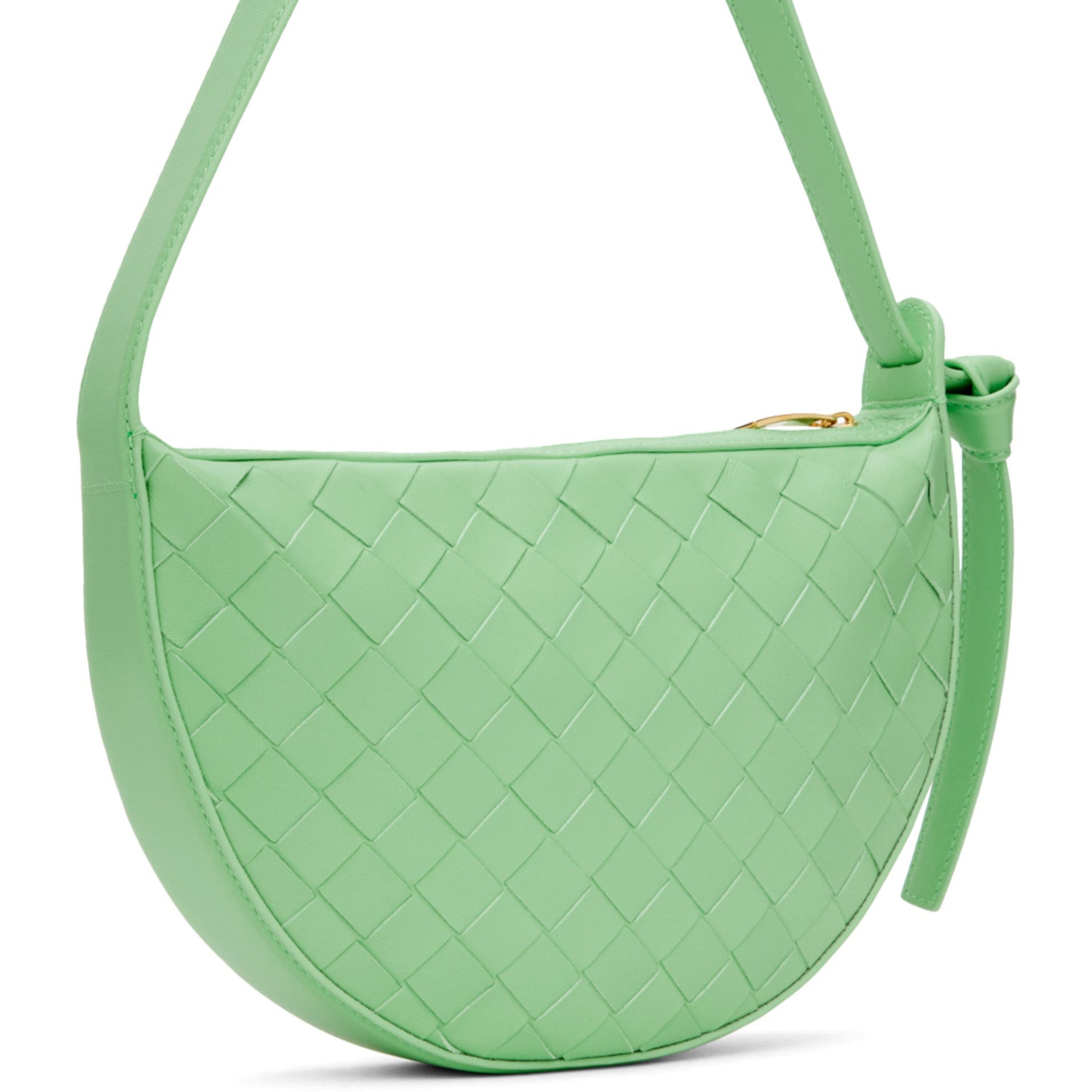 Green woven luxury Bottega handbag on a white background