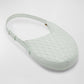 Light green woven luxury bottega handbag on a white background