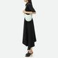 Woman holding a light green Bottega  handbag against a white background